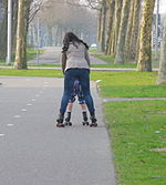 Mother teaches her child skating for mothers, this is also distractions and movement also good for digestion and to prevent constipation.JPG